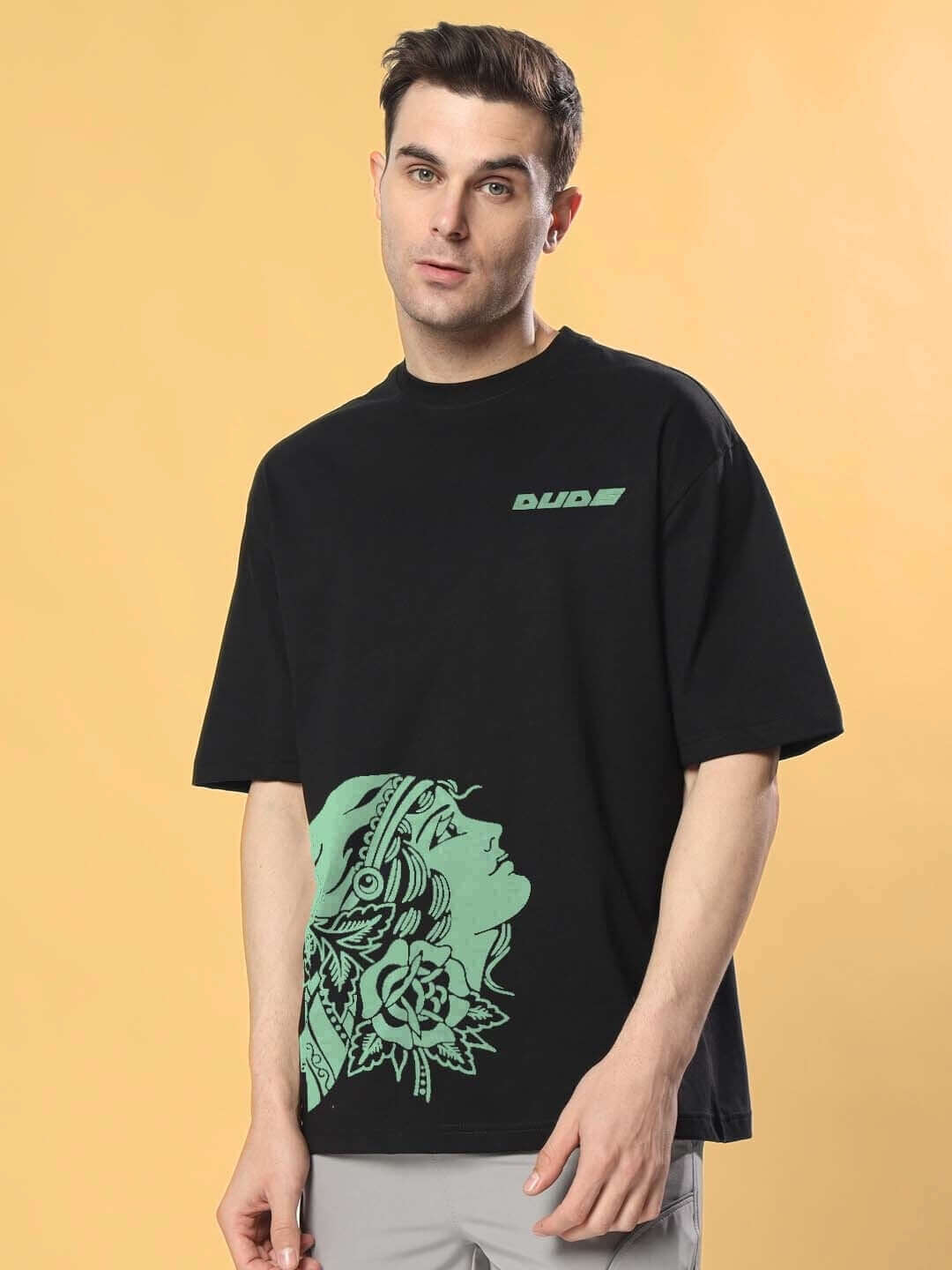 Man wearing KINNAUR OVER-SIZED T-SHIRT BLACK with custom fit option from DUDS