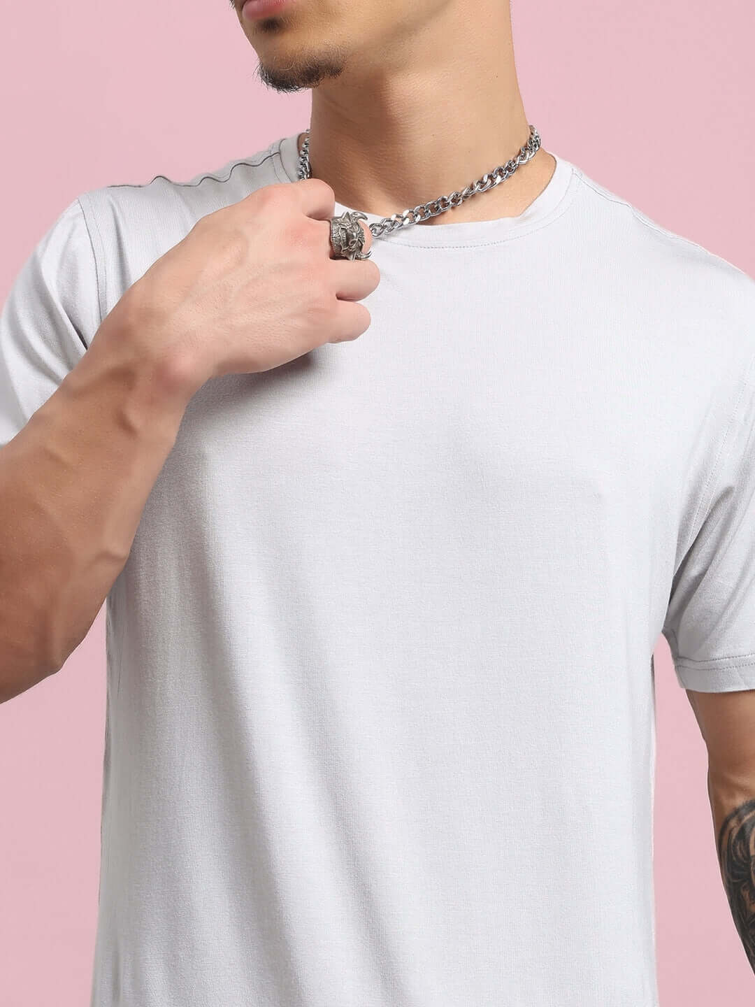 Man wearing a grey AMBLE T-shirt made from premium heavy gauge modal fabric, ideal for casual wear; emphasizing style and comfort.