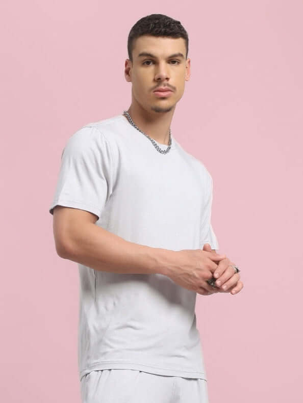 Model wearing AMBLE T-Shirt in grey, made from premium heavy gauge modal fabric, bio-washed. Manufactured in India. Stylish and comfortable.