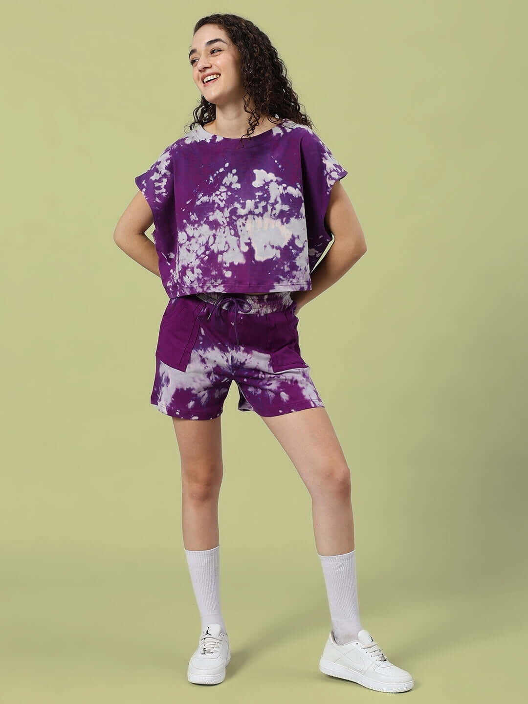 Women's purple tie-dye co-ord set featuring a loose top and shorts made of heavy gauge cotton fabric, perfect for casual wear.
