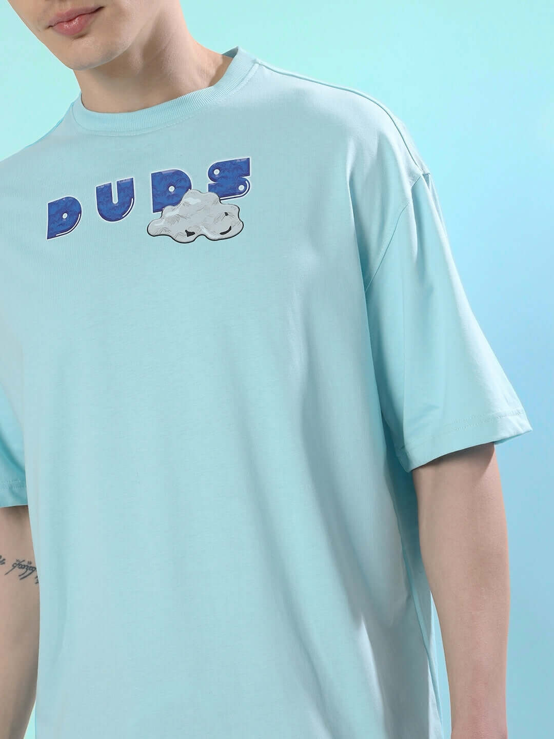 DUDS CREATIVE OVER-SIZED T-SHIRT SKY BLUE in premium cotton fabric, featuring bold lettering and cloud design on the chest.