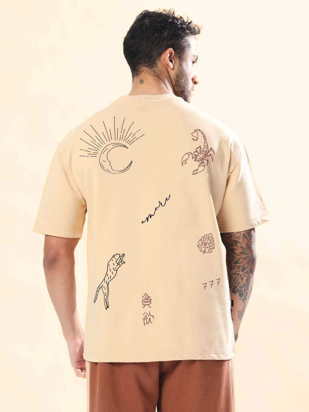 Back view of MORE 777 OVER-SIZED T-SHIRT BEIGE with printed designs on premium heavy gauge fabric.