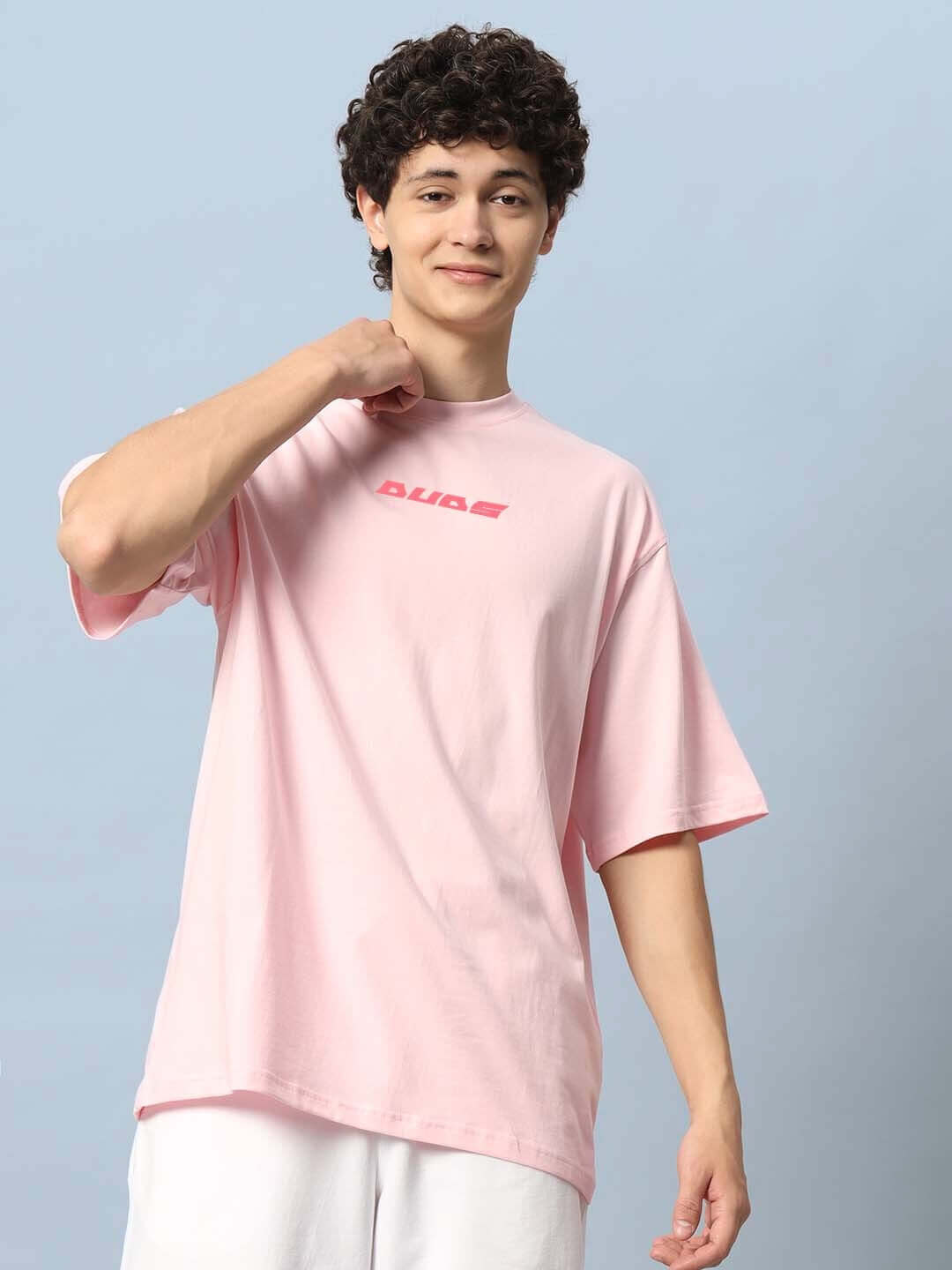 Man wearing DYING GOD OVER-SIZED T-SHIRT PINK by DUDS with casual fit