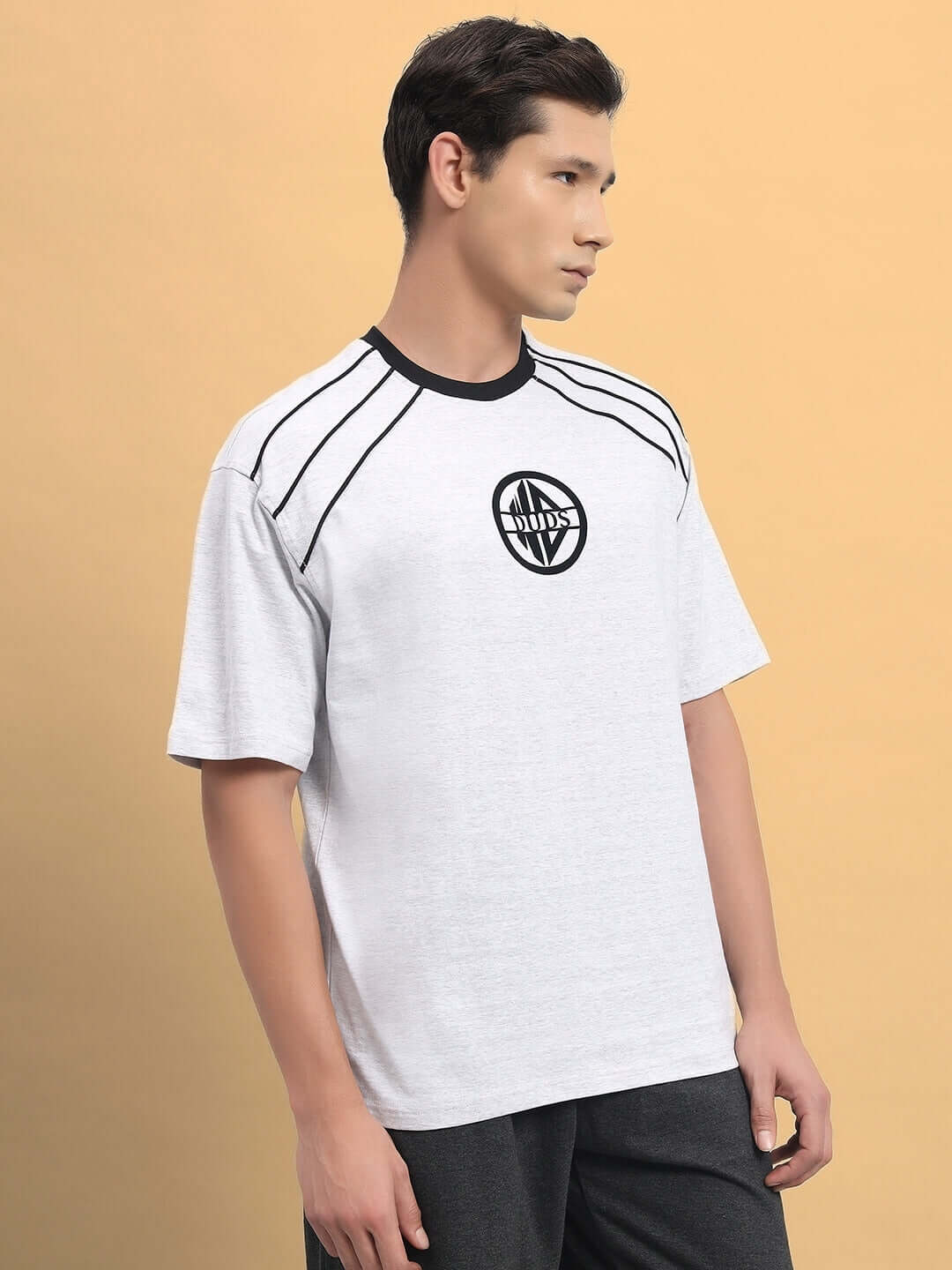 Model wearing PERCY OVER-SIZED T-SHIRT MELANGE GREY, featuring premium heavy gauge fabric in 97% cotton French terry and 3% elastane.