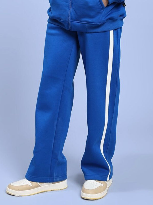 Man showcasing RAPID STRIDE FLEECE JOGGER ROYAL BLUE with tapered fit.