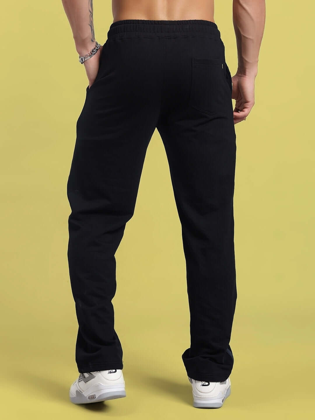 Back view of black Flicker Jogger pants showcasing fit and design, available with custom sizing from DUDS.