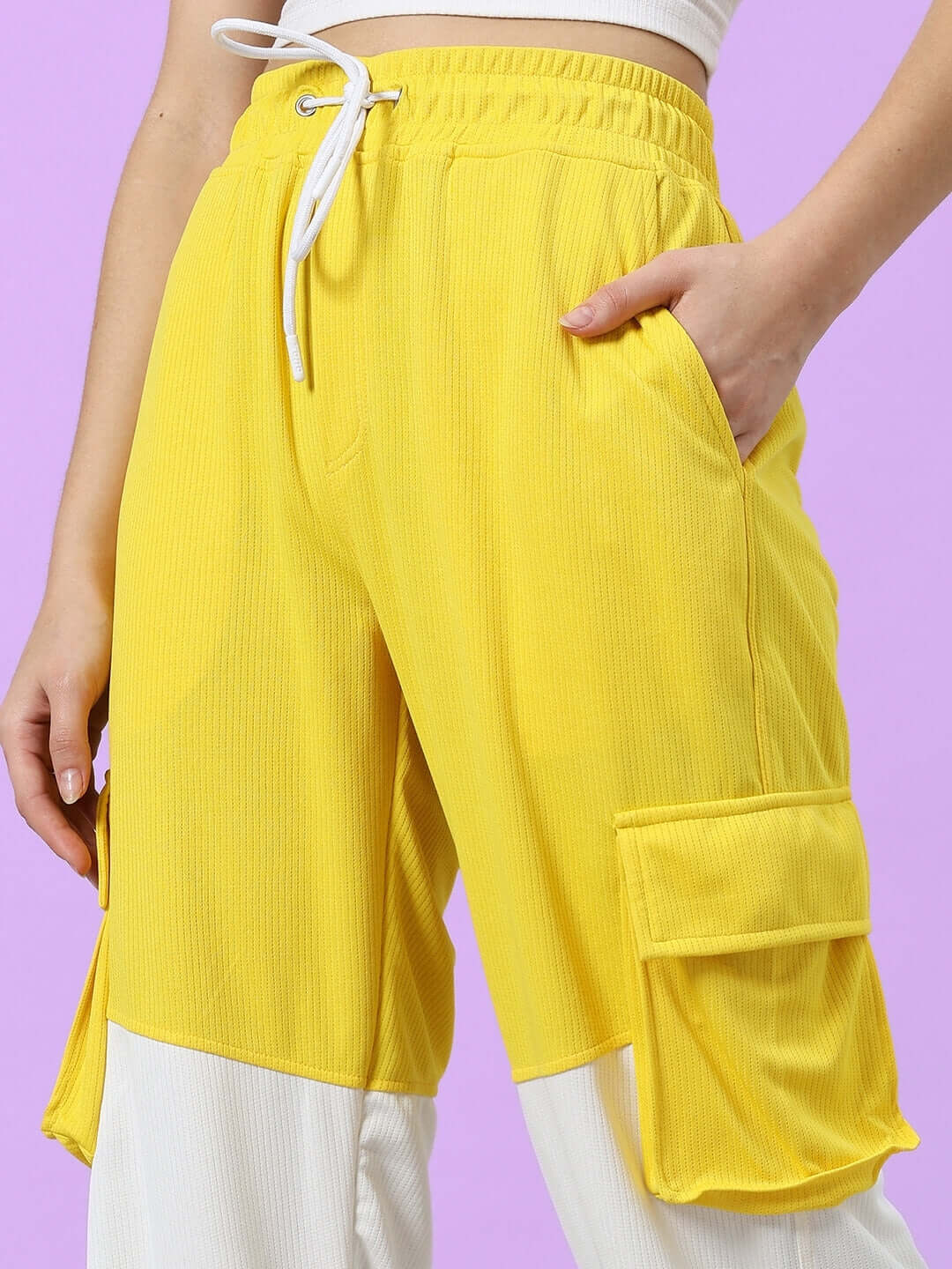 Women's radiant relaxed fit joggers in yellow and white with pockets, designed by DUDS. Made to order and customizable.