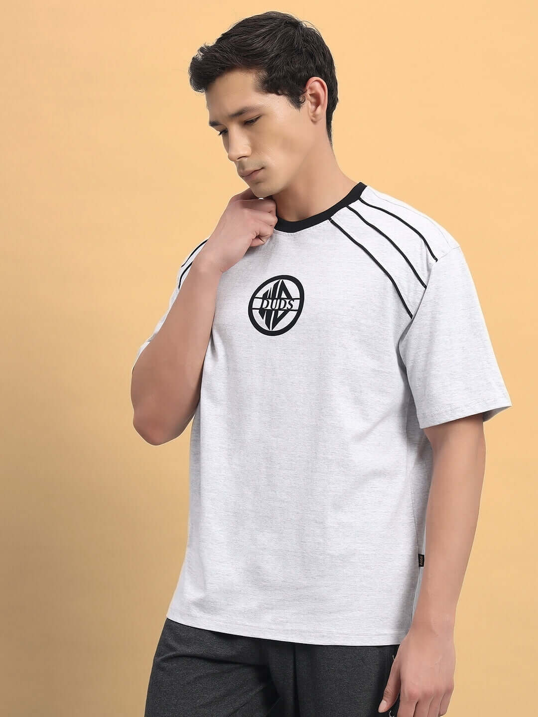 Man wearing PERCY OVER-SIZED T-SHIRT MELANGE GREY made with premium heavy gauge fabric and French terry cotton