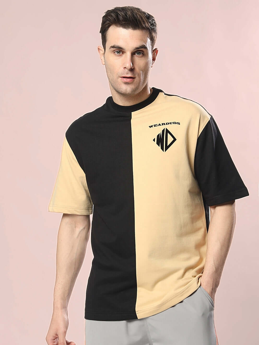 Model wearing DRAGON OVERSIZED T-SHIRT BLACK BEIGE made from premium cotton French terry.