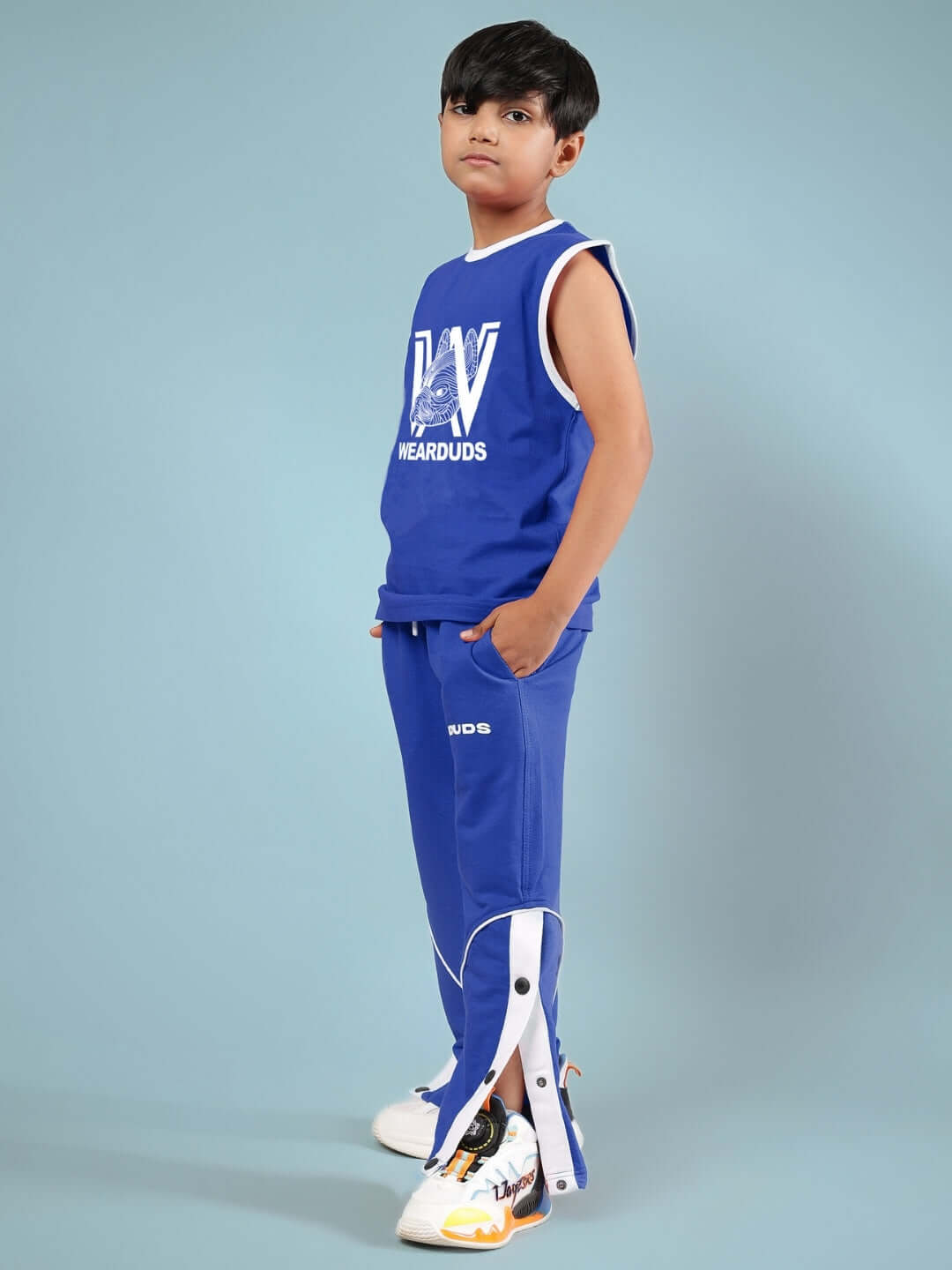 Young boy wearing blue Washington Huskies co-ord set for kids, featuring DUDS logo, showcasing customizable fashion for boys and girls.