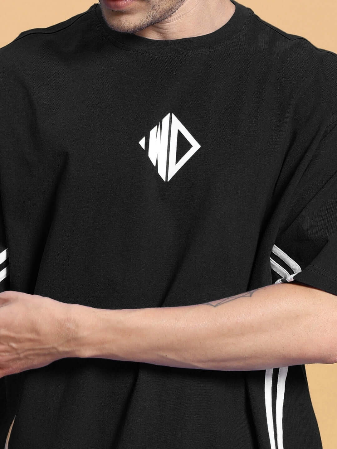 Close-up of black summer co-ord shorts set with geometric logo, made from premium cotton French Terry fabric, by Outlook.