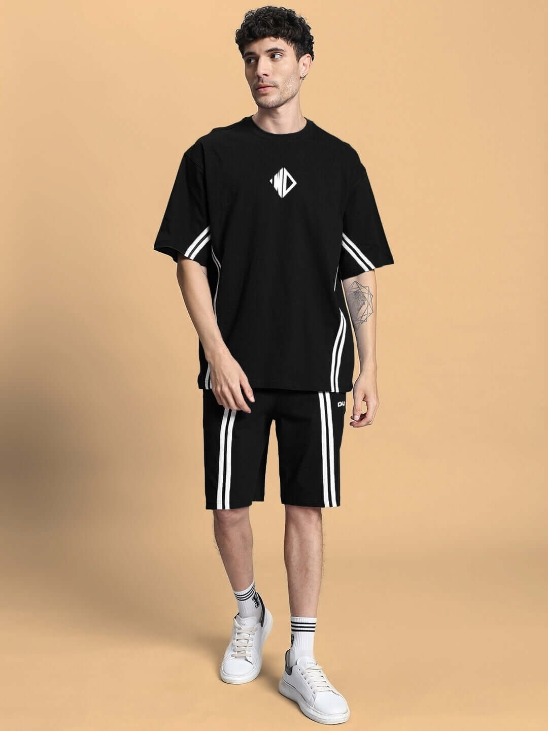 Model wearing black Outlook Regular Fit Shorts with white stripes and matching t-shirt, suitable for casual style and custom fit options.