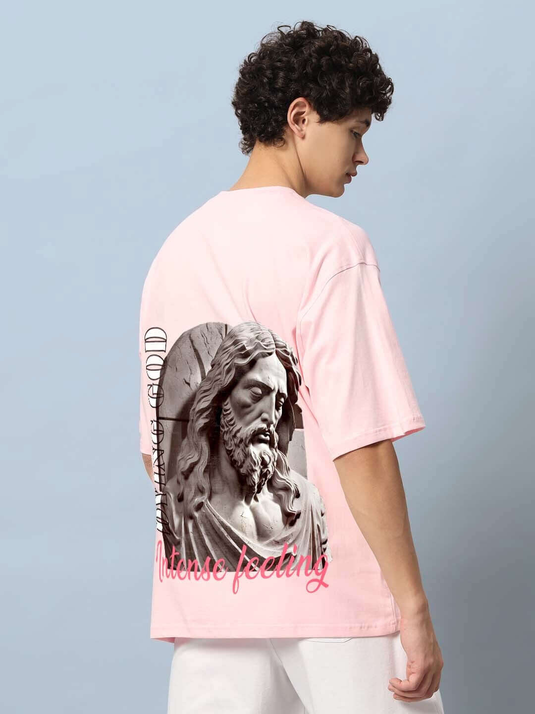 Back view of DYING GOD OVER-SIZED T-SHIRT PINK with graphic design on back.