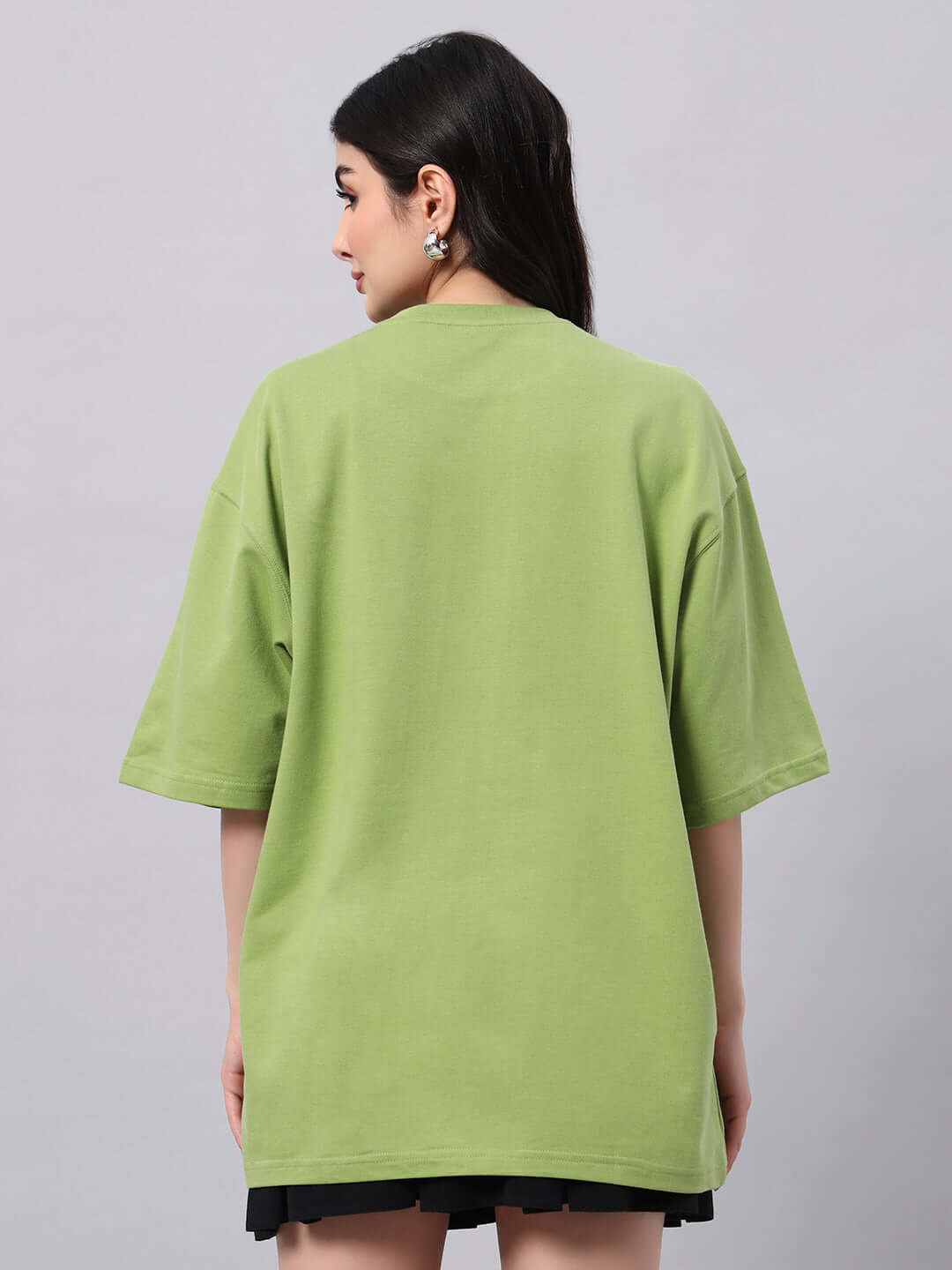 Back view of woman's green Ikon Butterfly T-shirt made from premium cotton fabric, highlighting casual style and comfort.
