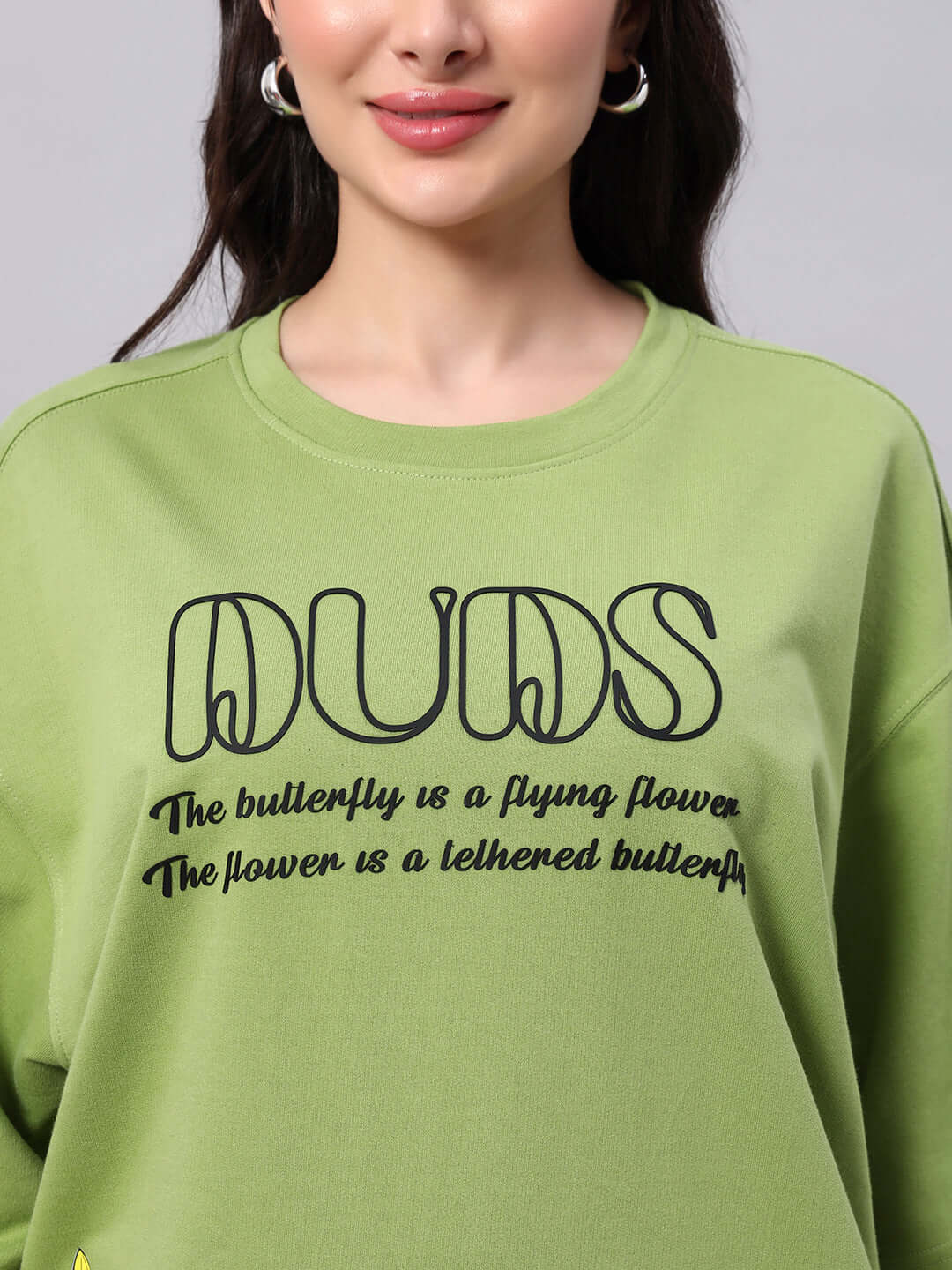 Green women's IKON butterfly T-shirt with black text design, made from premium heavy gauge fabric, 97% cotton, French terry.