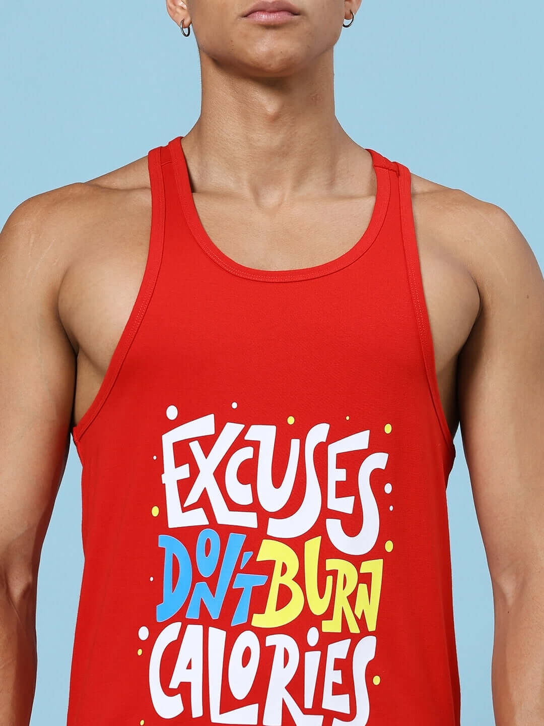 Red gym tank top with bold text 'Excuses Don't Burn Calories' in vibrant colors.