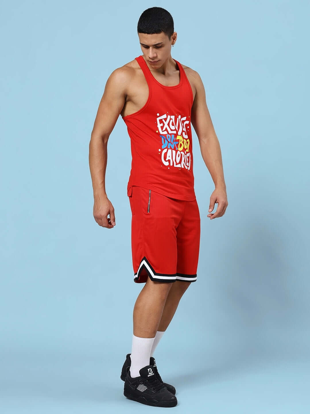 Red gym co-ord set with 'Excuses Don't Burn Calories' print, featuring premium cotton t-shirt and sports polyester shorts.