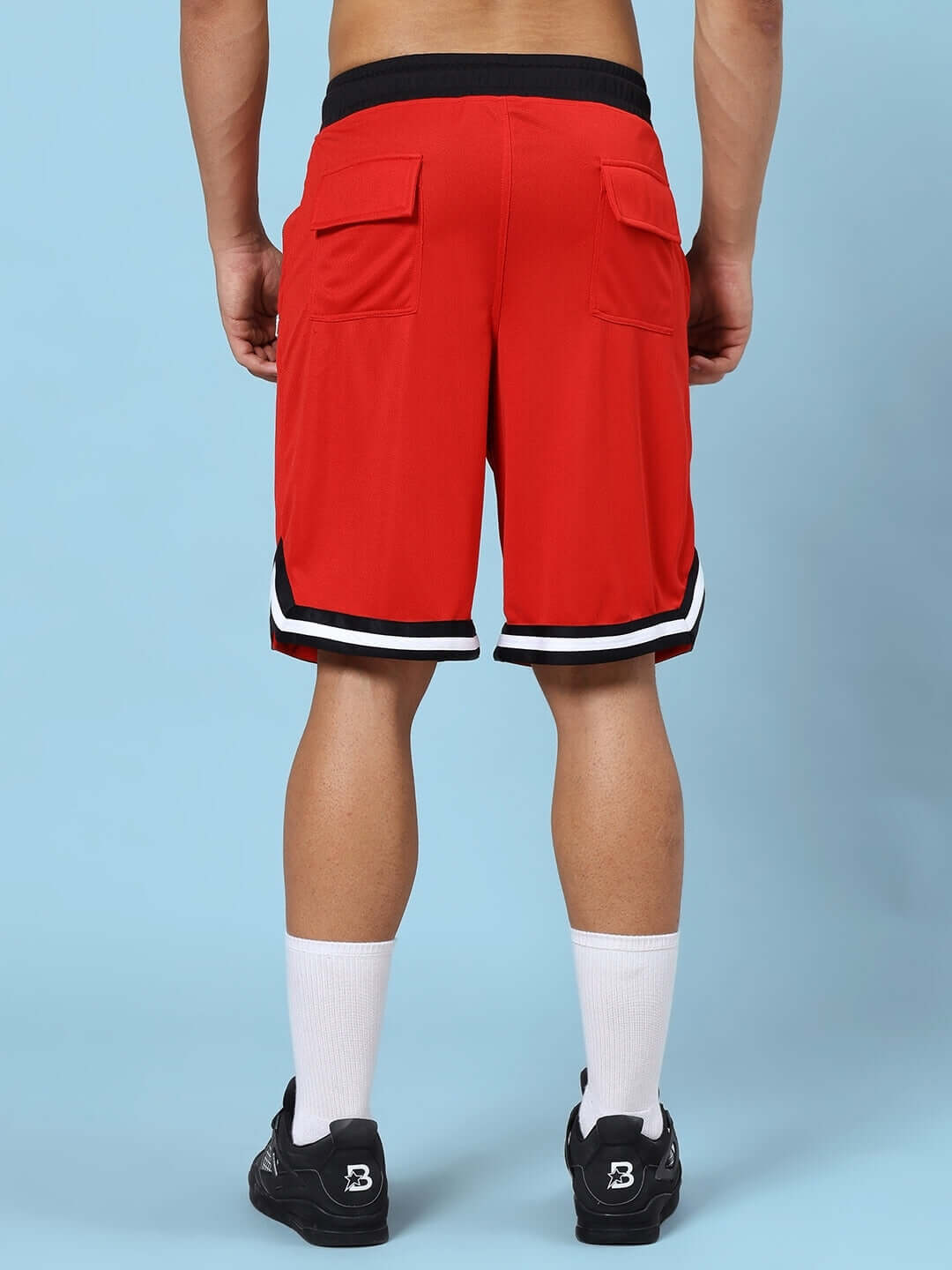 Rear view of red gym co-ord set featuring sports polyester fabric shorts, ideal for workouts. Excuses don't burn calories.