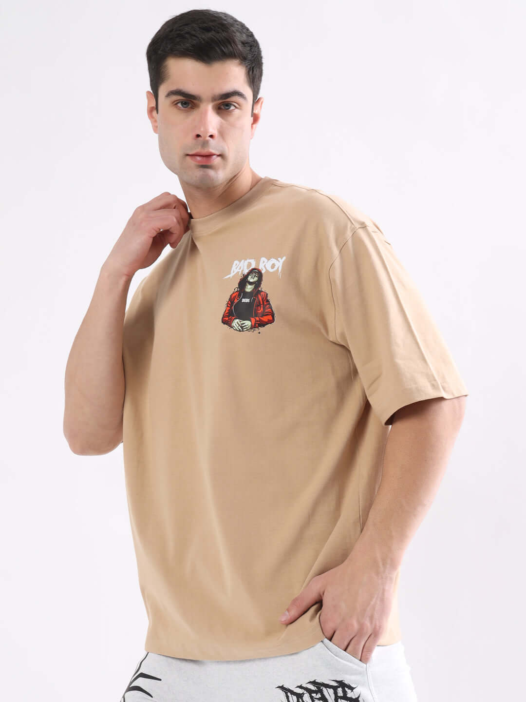 BAD BOY OVER-SIZED T-SHIRT NUDE in premium heavy gauge fabric, 100% cotton, featuring stylish design, worn by model. Perfect casual wear.