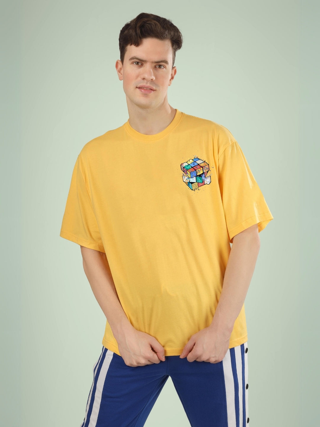 RUBIK REVOLUTION OVERSIZED T-SHIRT YELLOW shown on a model with a custom fit option available for orders.