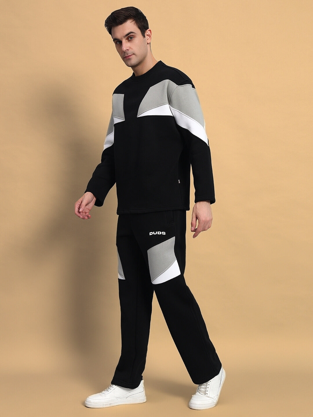 Aviator colorblock co-ord set in black with grey and white accents, featuring a modern design and comfortable fit, worn by a male model.