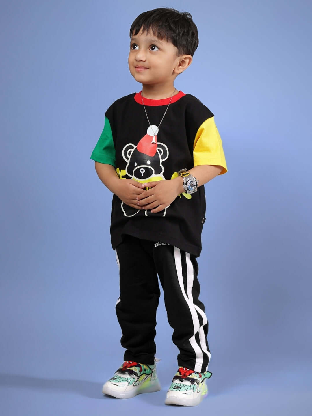 Child wearing black MOCHA co-ord set with colorful sleeves, featuring a bear design, ideal for boys and girls by DUDS.