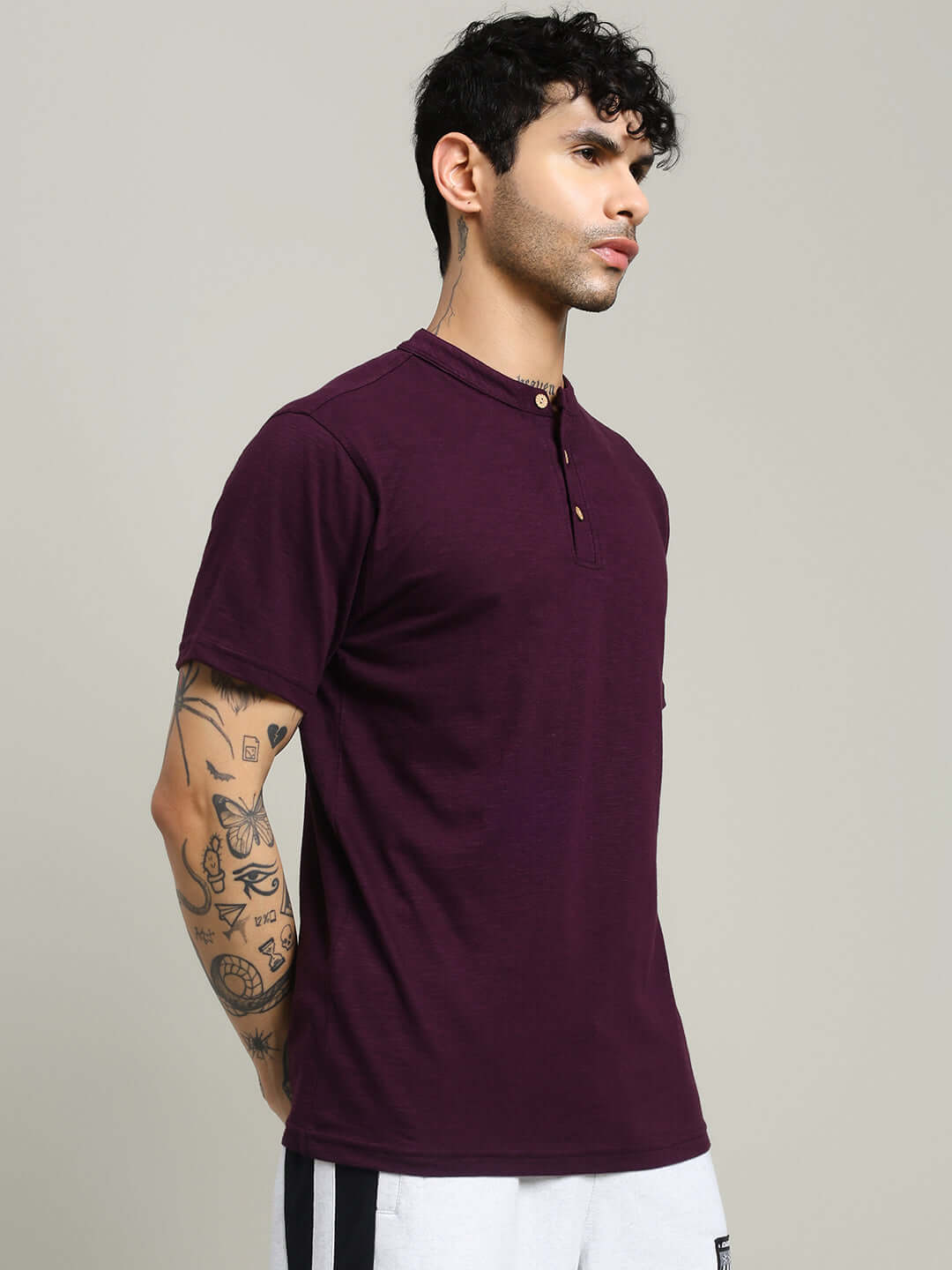 Model wearing Albet regular fit purple T-shirt made from premium cotton slub fabric, bio-washed for softness, ideal for casual wear.