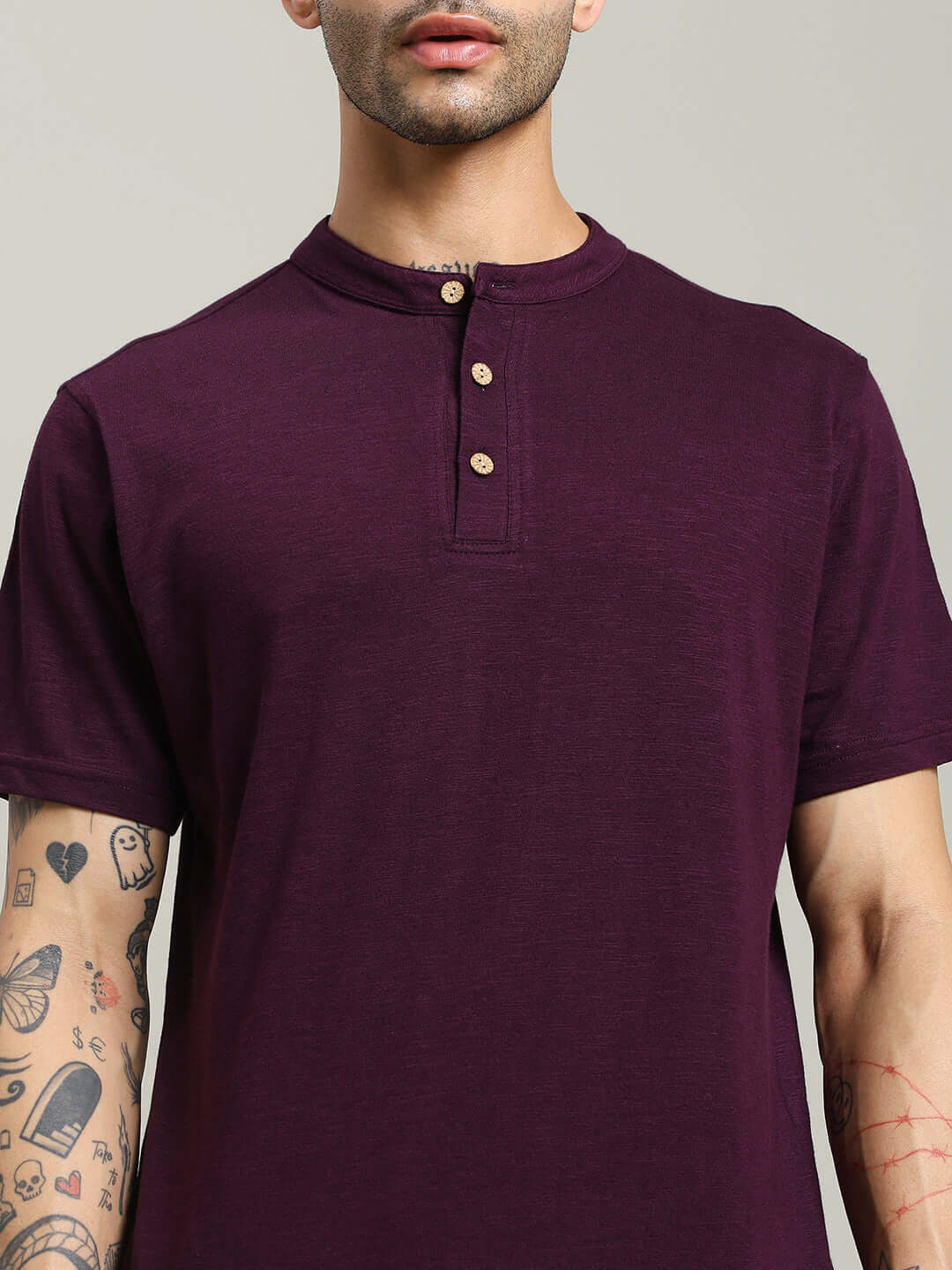Man wearing Albet Regular Fit Purple T-Shirt made from premium heavy cotton slub fabric with tattooed arms for a stylish look.