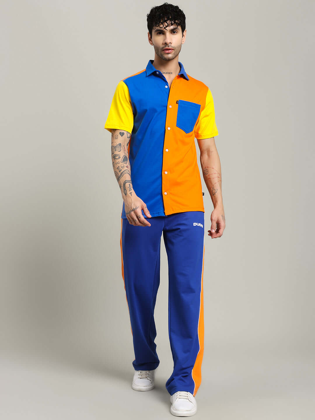 Model wearing APEX Regular Fit Shirt in Multi Orange with vibrant colors, made by DUDS, available with Custom Fit for prepaid orders.
