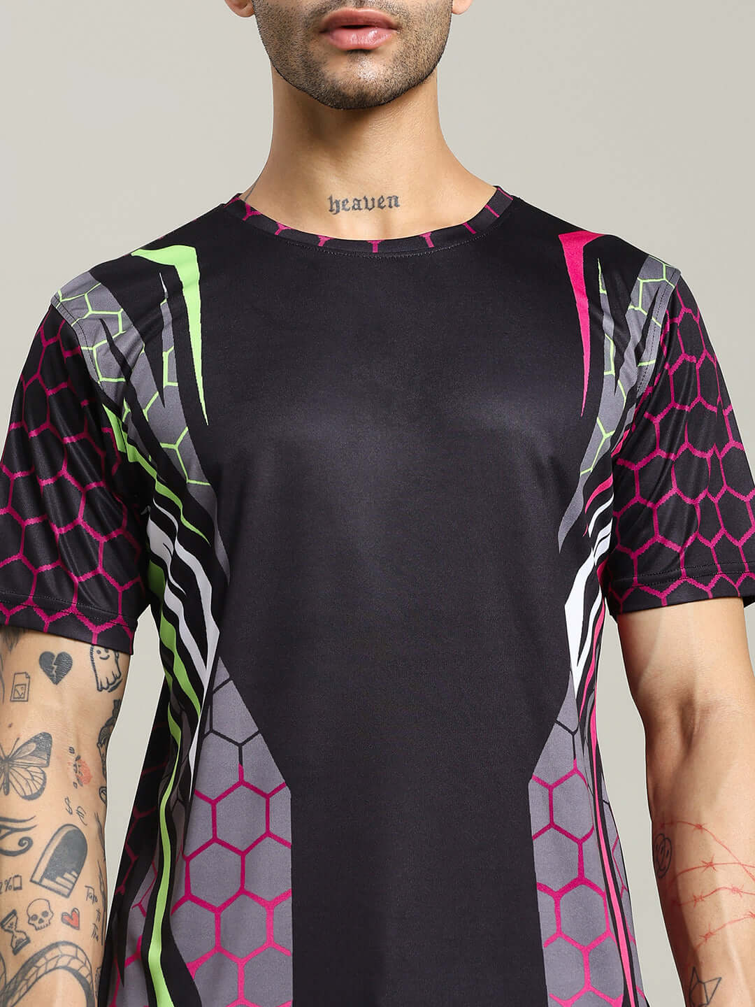 Man wearing Hexagon Printed Regular Fit T-Shirt Black with colorful hexagon design, showcasing modern casual fashion.