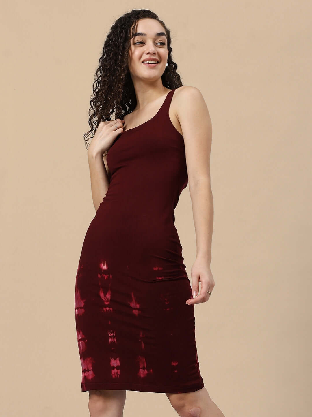 Woman wearing maroon Fergie cool tie-dye dress made from premium cotton fabric, featuring a comfortable fit and elegant design.