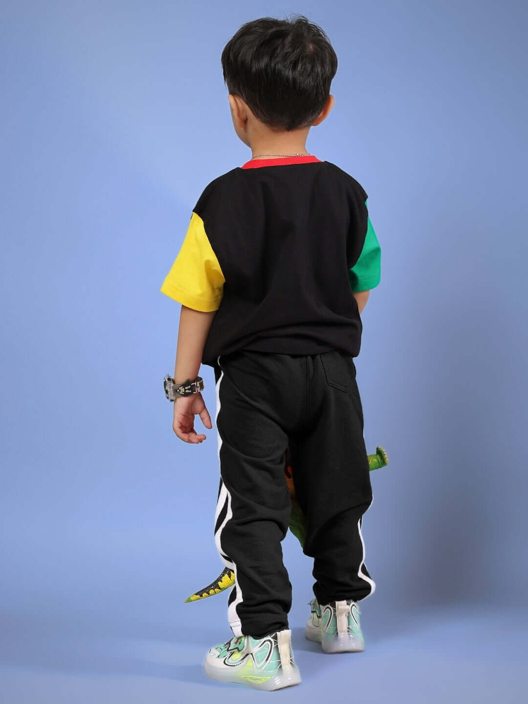 Child wearing colorful MOCHA CO-ORD set in black with vibrant sleeves, tailored by DUDS. Suitable for boys and girls, available in custom sizes.