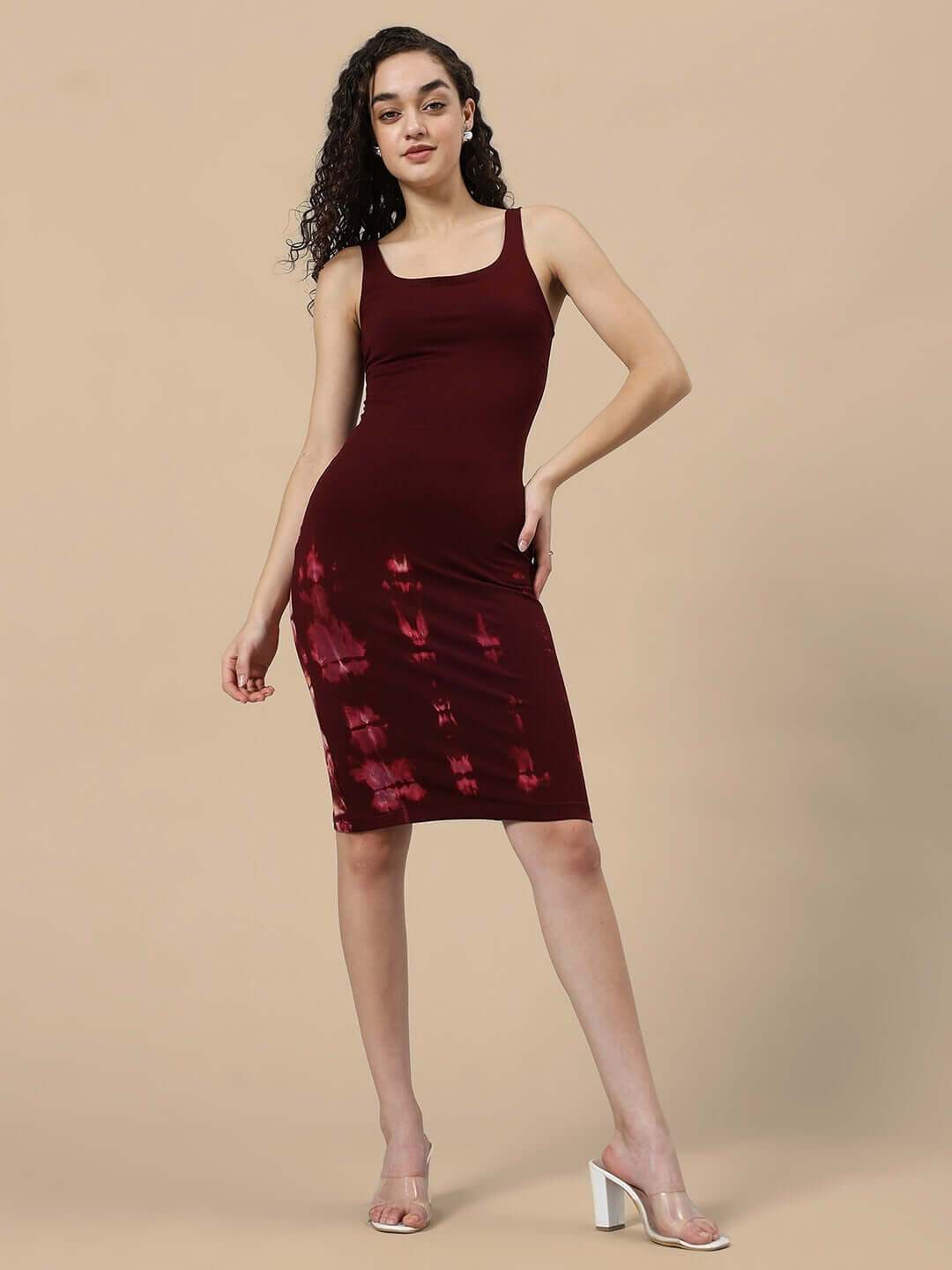 Woman wearing maroon Fergie Cool tie-dye dress made of premium cotton French terry fabric, showcasing a chic, stylish look.