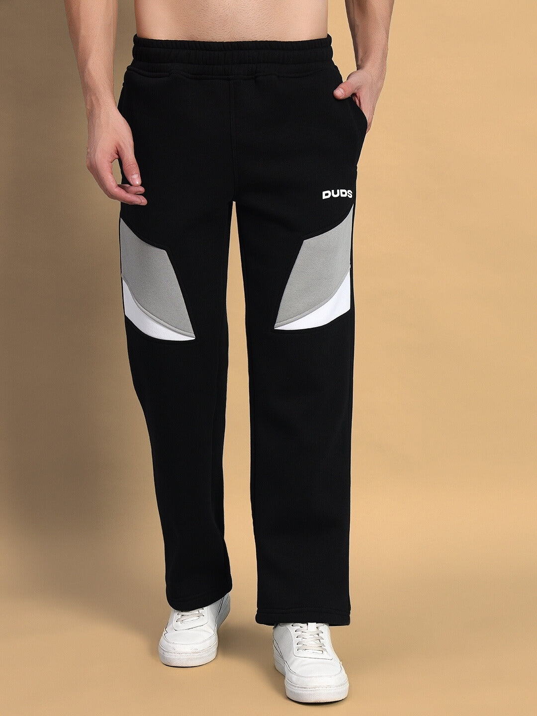 Person wearing black Aviator Colorblock Co-ord pants with grey and white detailing, showcasing contemporary streetwear fashion.