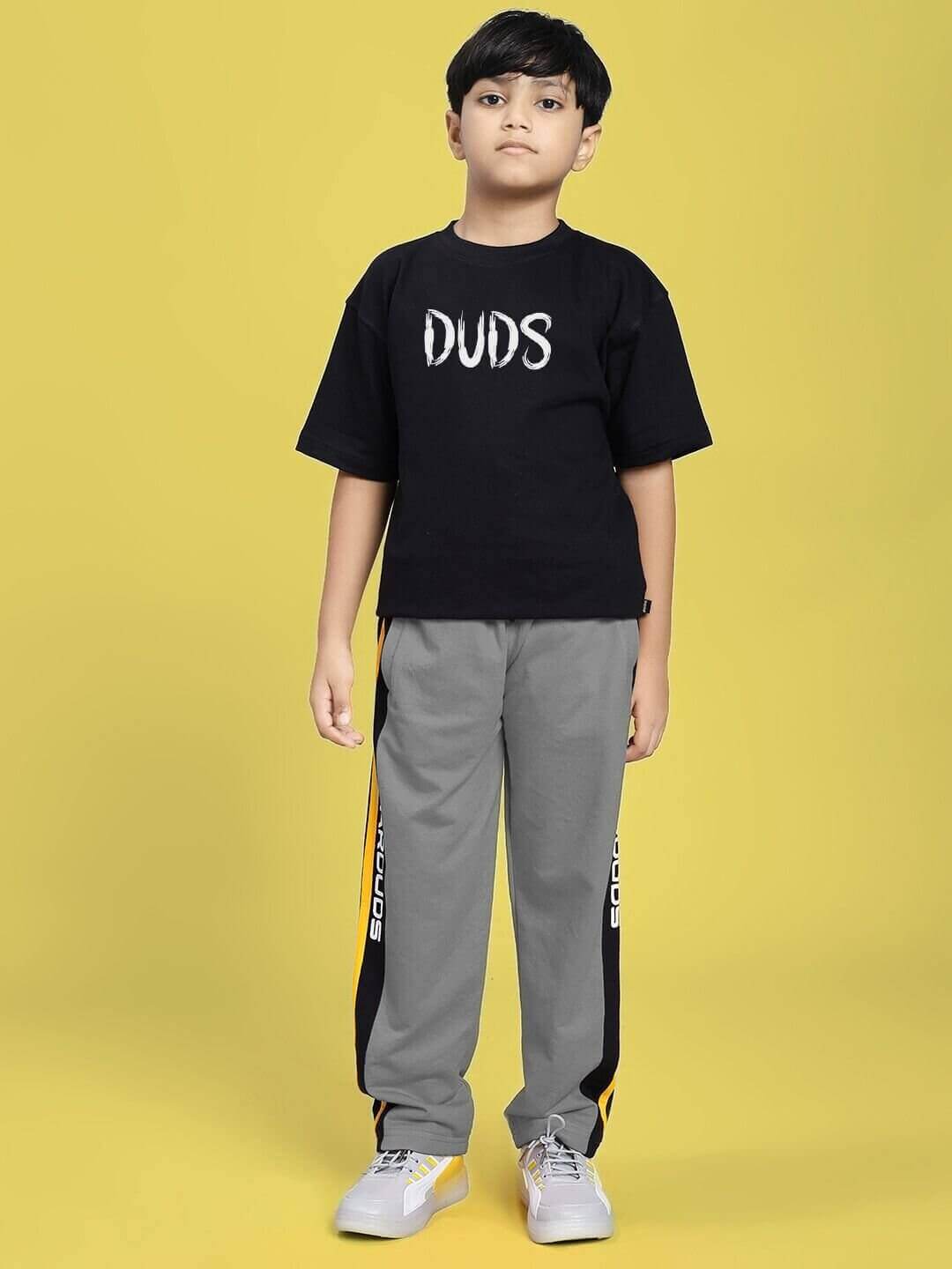 Child wearing black MINING THE MOONLIGHT PRINT T-SHIRT FOR BOYS AND GIRLS BLACK, showcasing bold street-style design.