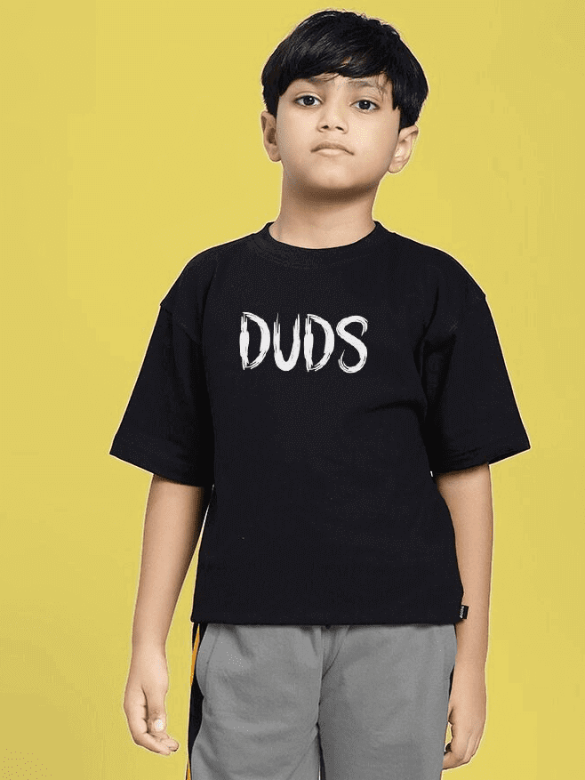 Child wearing MINING THE MOONLIGHT PRINT T-SHIRT FOR BOYS AND GIRLS BLACK with bold print, yellow background.