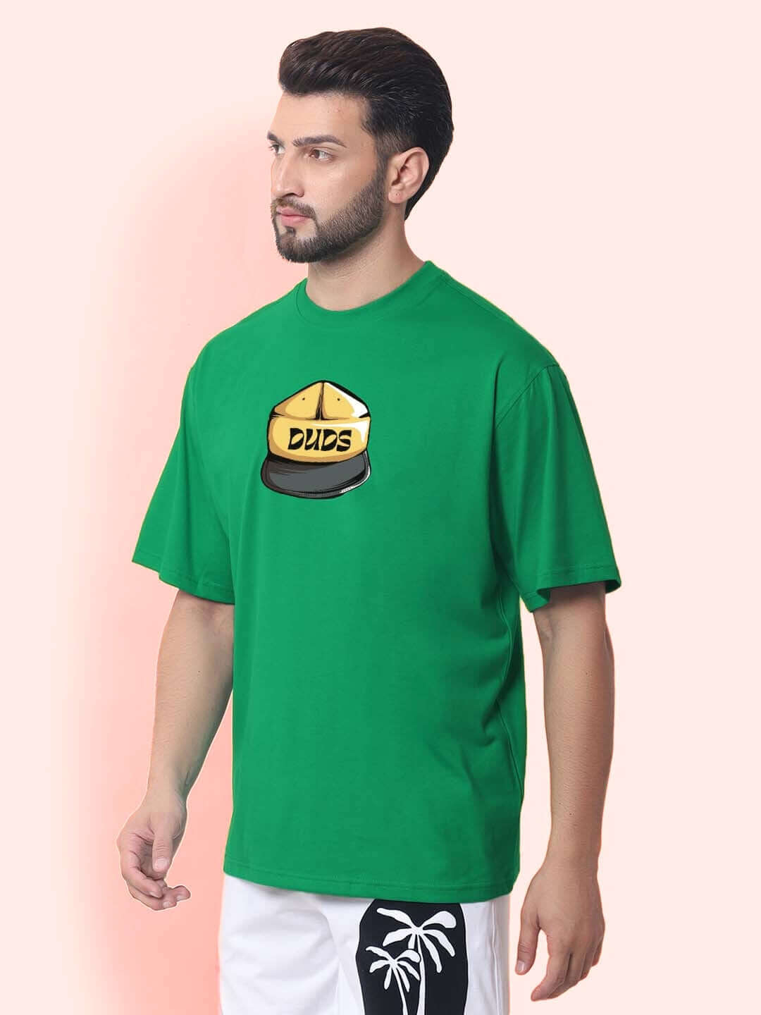 Model Wearing HIGH-ON OVER-SIZED T-SHIRT GREEN with DUDS Logo, Custom Fit Available for Prepaid Orders
