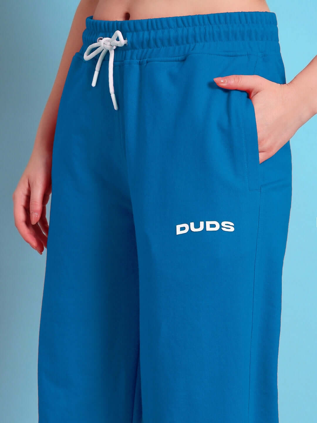 Women's Austrian relaxed-fit joggers in blue by DUDS, featuring an elastic drawstring waist and side pockets for comfort and style.