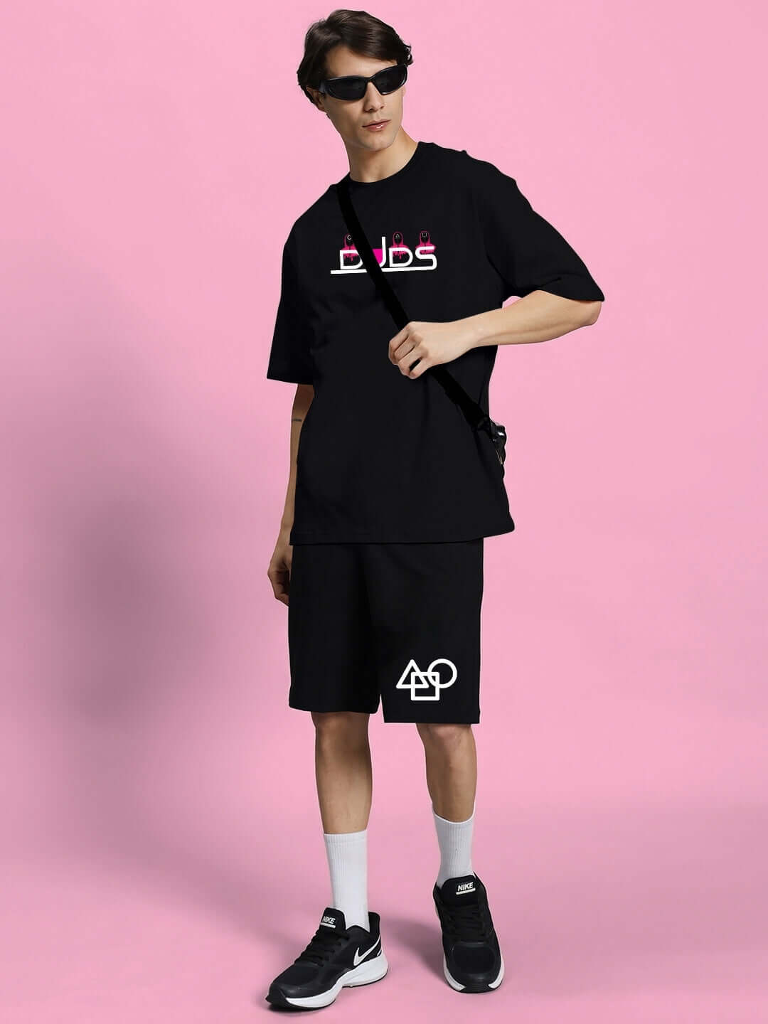 Model wearing Squid Game black summer co-ord set, featuring premium cotton terry fabric, suitable for casual wear.