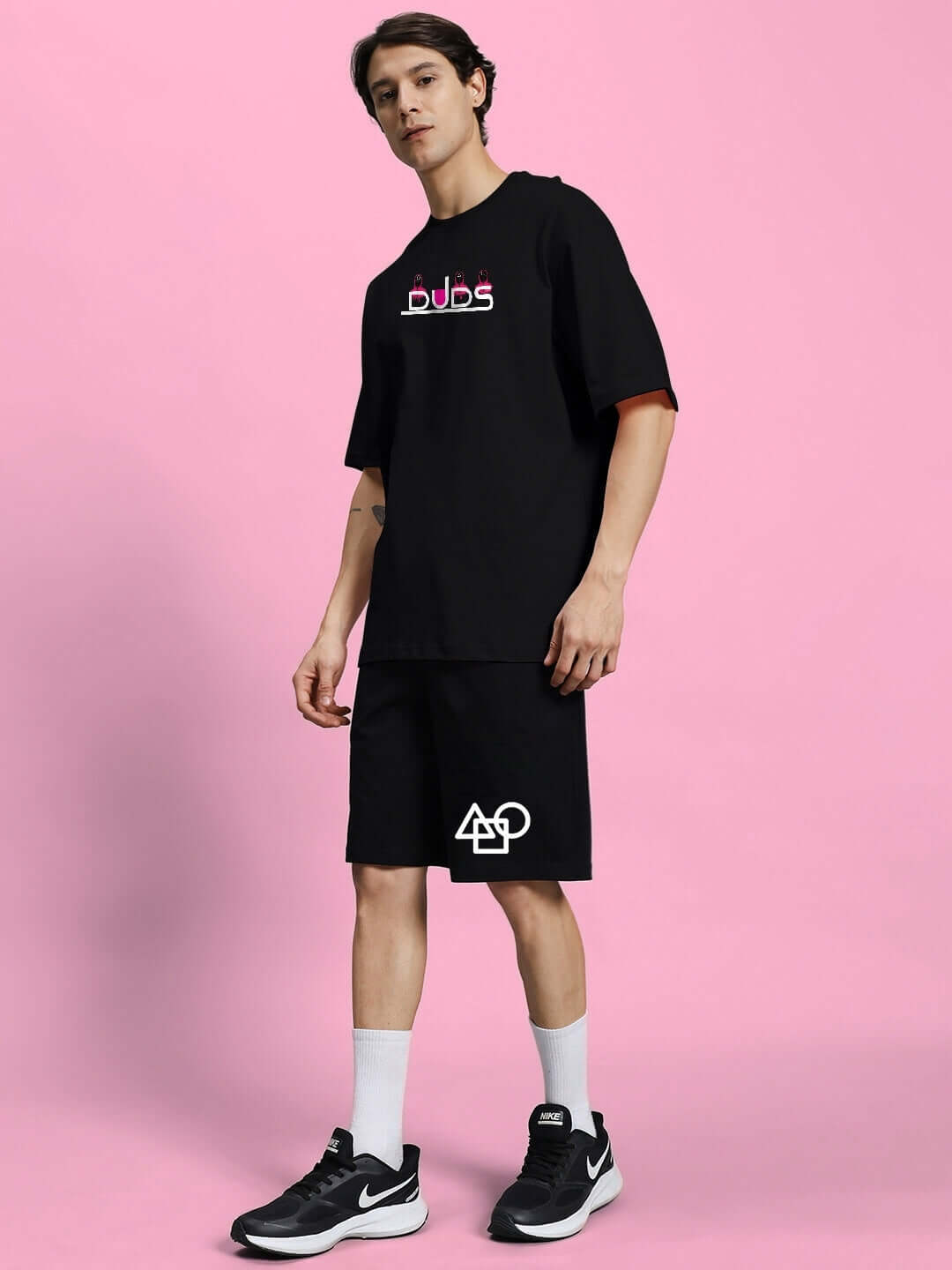 Model wearing SQUID GAME SUMMER CO-ORD SET in black, featuring premium heavy gauge fabric. Stylish and comfortable attire.