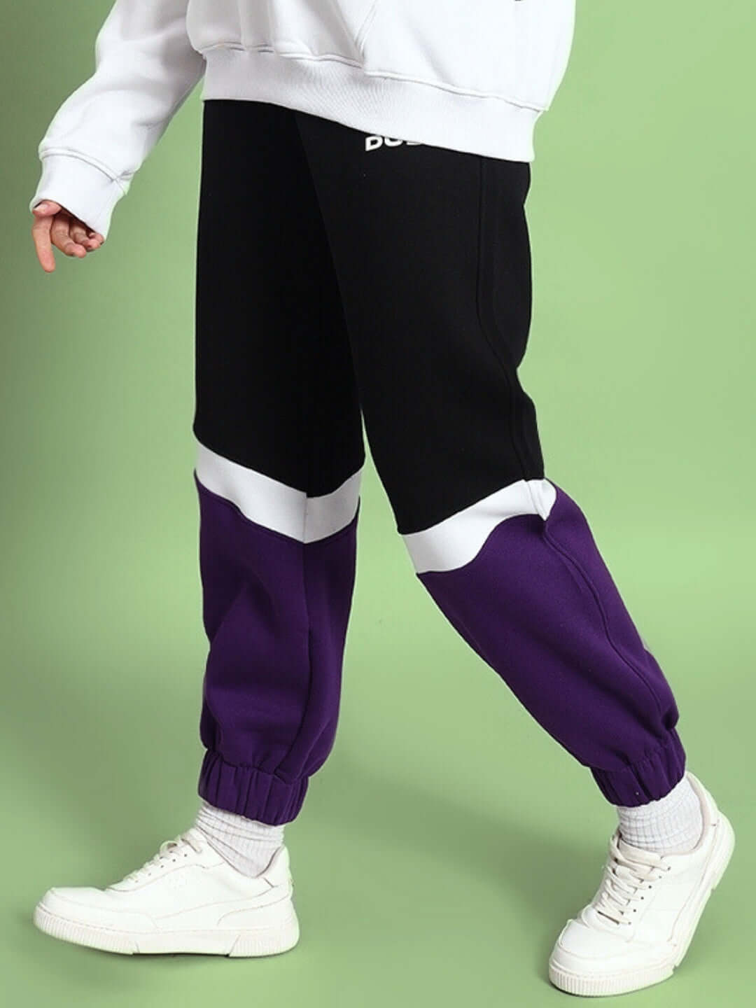Women's Harley Fleece Colorblock Jogger in Purple, comfortable black and purple joggers with white accents, styled casually with sneakers.