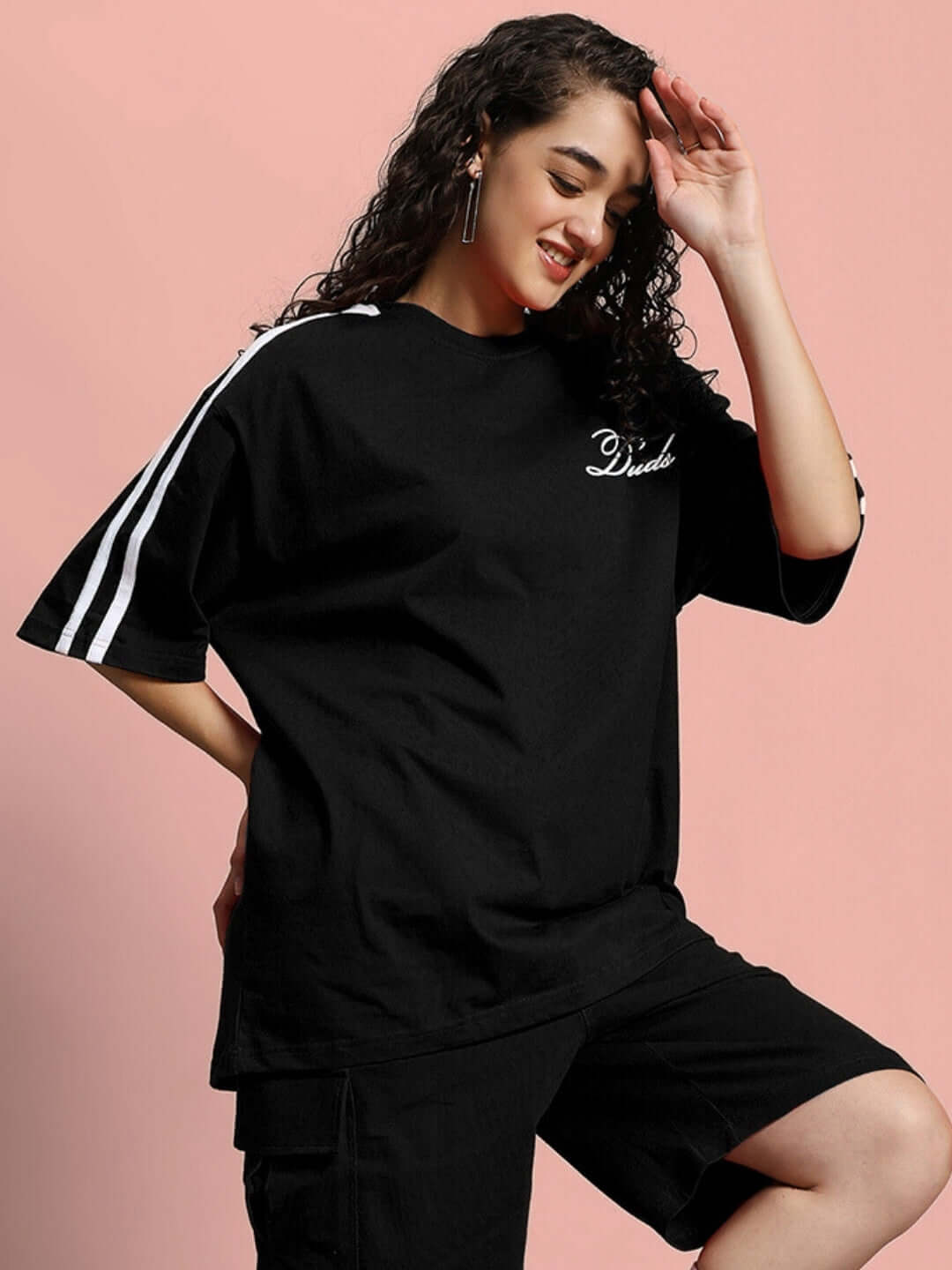 Model wearing Women's Scotia Over-Sized Black T-Shirt in premium cotton, showcasing casual style with comfort and elegance.