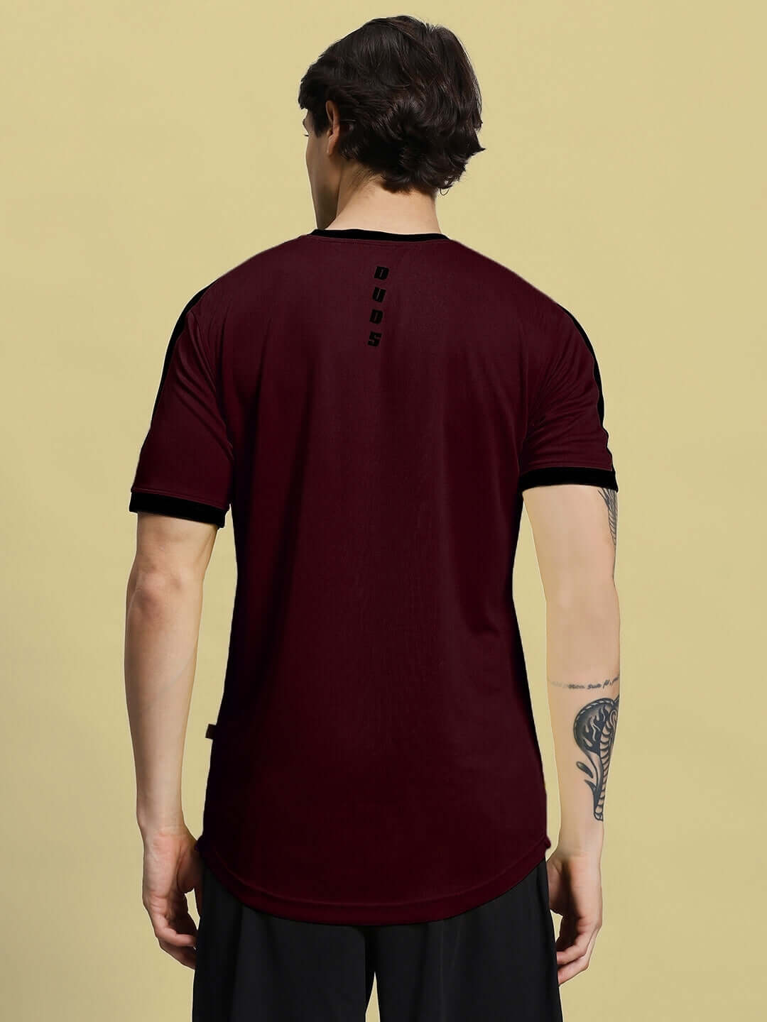 Back view of a maroon Sherpa regular fit t-shirt made from sports polyester, perfect for casual wear. Manufactured in India.