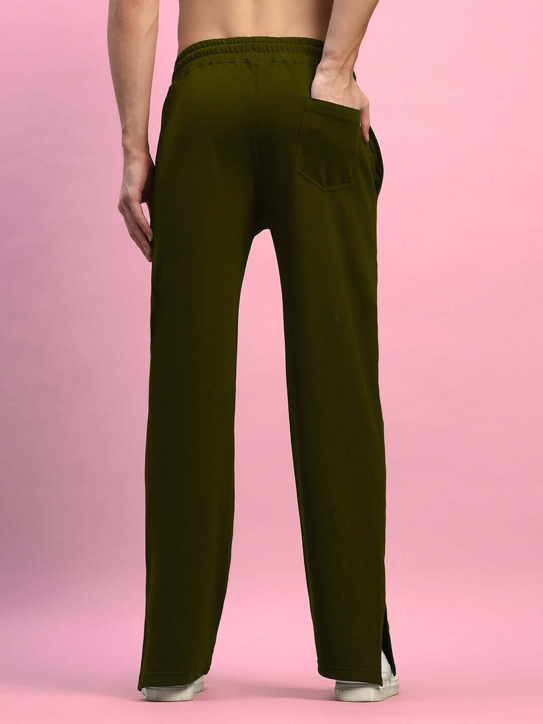 Back view of olive green Zion side slit joggers with elastic waistband, showcasing modern comfort and style, perfect for casual wear.