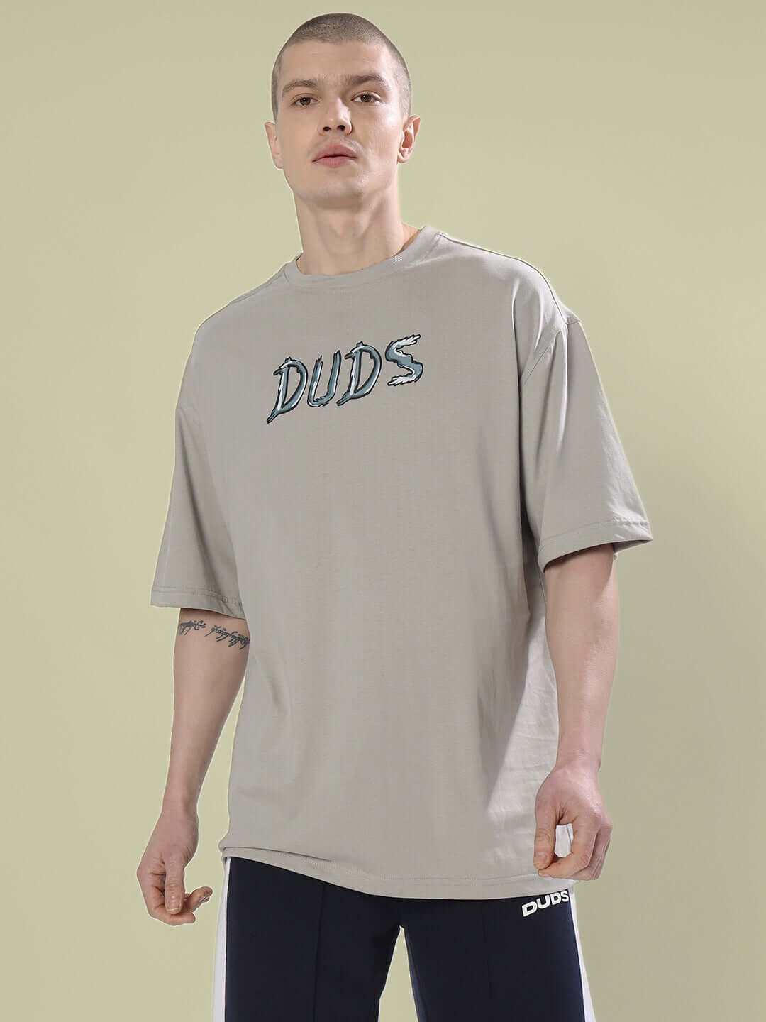 Model wearing POSITIVE RABBIT OVER-SIZED T-SHIRT GREY made of premium heavy gauge fabric, 100% cotton, 220 GSM bio-washed.