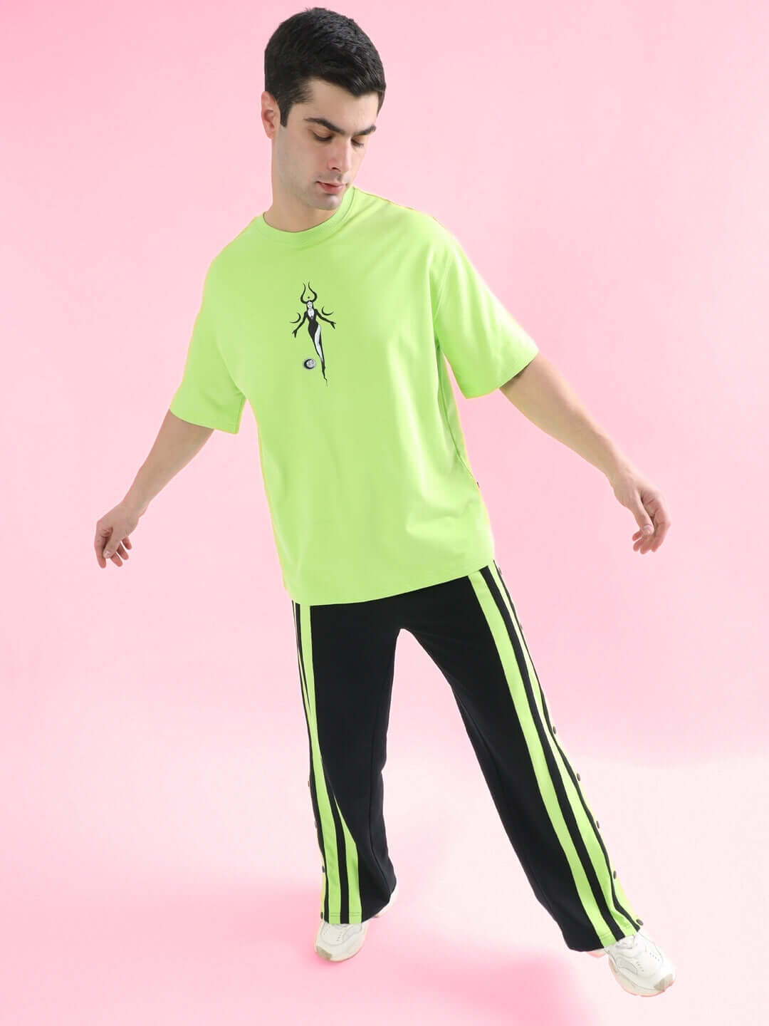 Model wearing BLACK MOON OVER-SIZED T-SHIRT NEON GREEN from WEAR DUDS, featuring bold streetwear design and breathable cotton fabric.