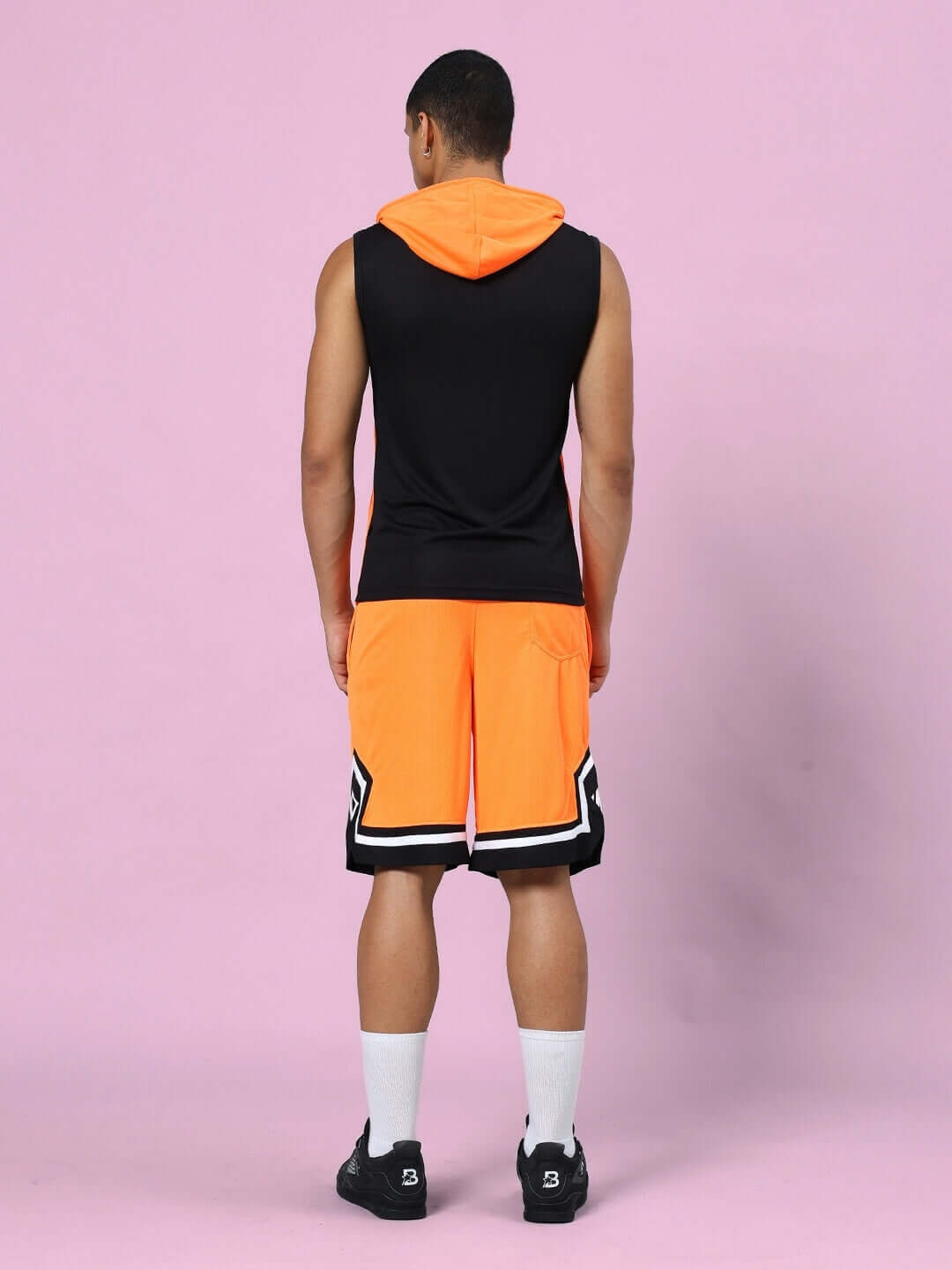 Back view of FRANKY GYM CO-ORD SET in orange and black, featuring sleeveless top and shorts. Ideal for workouts. Sports polyester fabric.