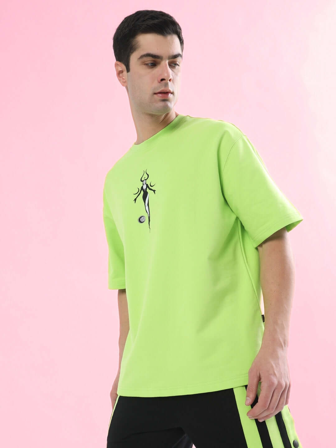 BLACK MOON OVER-SIZED T-SHIRT NEON GREEN modeled, featuring bold moon graphic and trendy design on breathable cotton fabric.