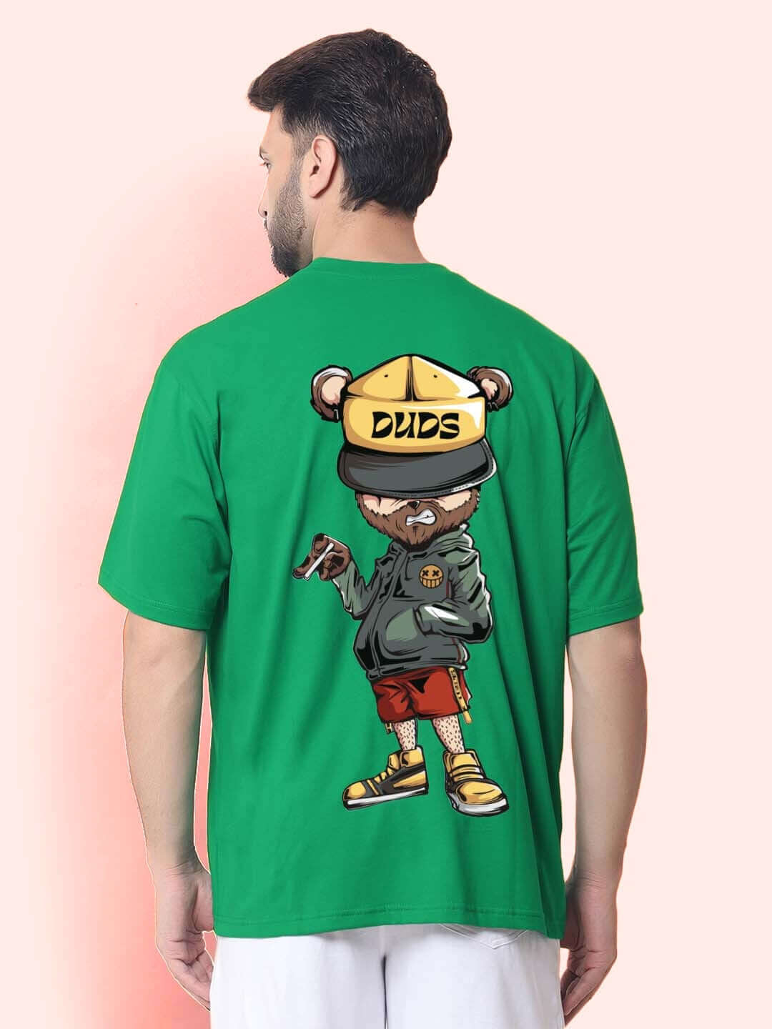 Man wearing HIGH-ON OVER-SIZED T-SHIRT GREEN with graphic design by DUDS.