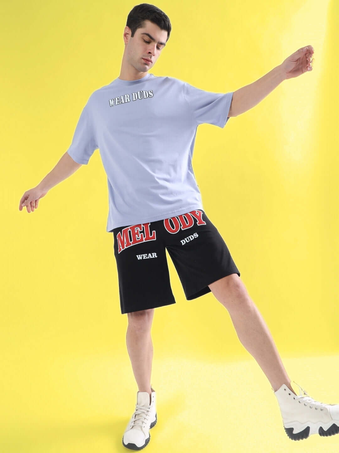 RAPPER BUNNY OVER-SIZED T-SHIRT LILAC on model with sports shorts, vibrant yellow background